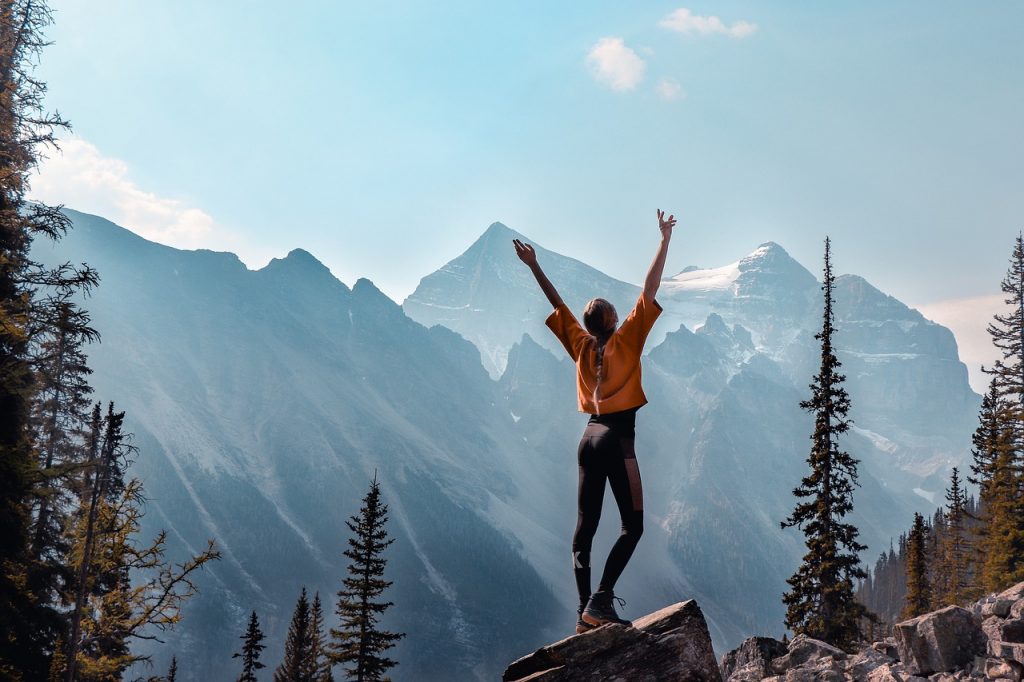 Woman celebrating reaching the peak